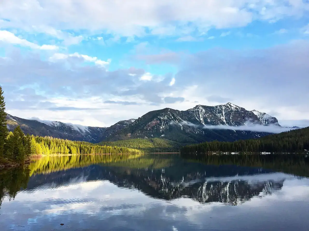 Hyalite Reservoir reflecting the Gallatin Range